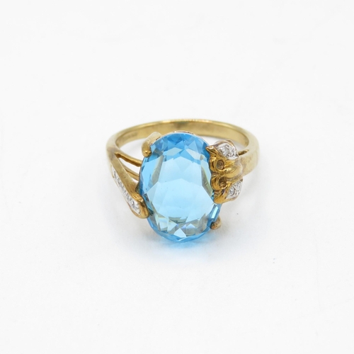 155 - 9ct gold blue topaz & diamond dress ring with butterfly mount (5.5g) Size  O