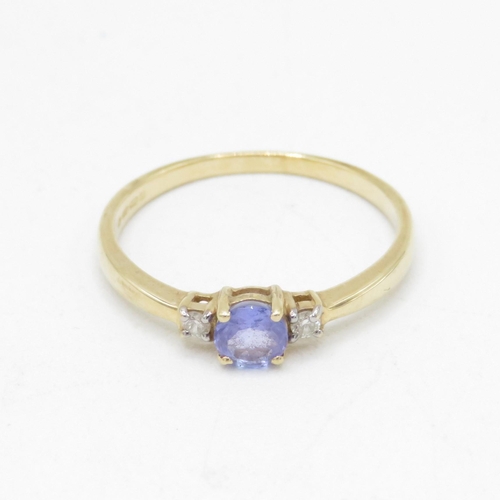 106 - 14ct gold tanzanite & diamond three stone ring (1.9g) Size  P