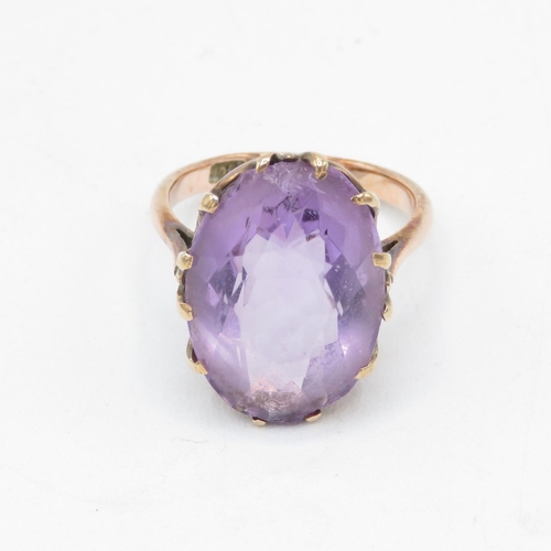 96 - 9ct gold oval cut amethyst dress ring (5.4g) Size  L