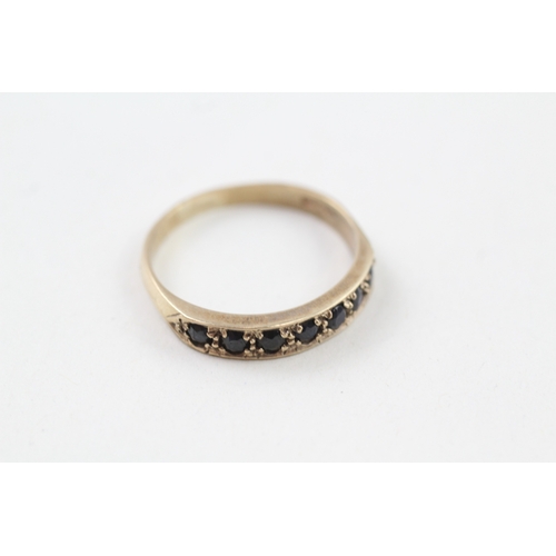 104 - 9ct gold sapphire half eternity ring (2.4g) Size  R