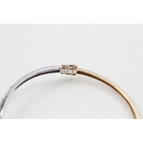 108 - 9ct gold diamond hinged bangle (6.7g)