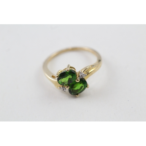 114 - 9ct gold oval cut diopside & diamond dress ring (2.5g) Size  O