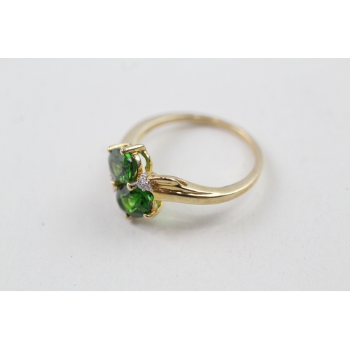 114 - 9ct gold oval cut diopside & diamond dress ring (2.5g) Size  O