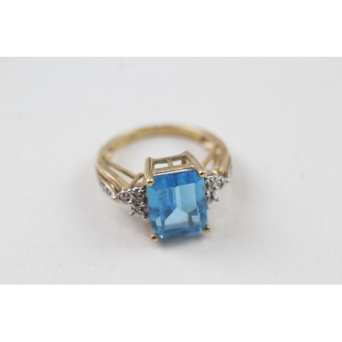 117 - 9ct gold blue topaz & diamond dress ring (3.5g) Size  J