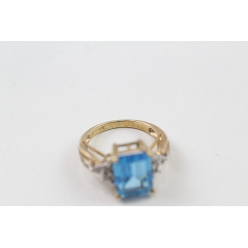 117 - 9ct gold blue topaz & diamond dress ring (3.5g) Size  J