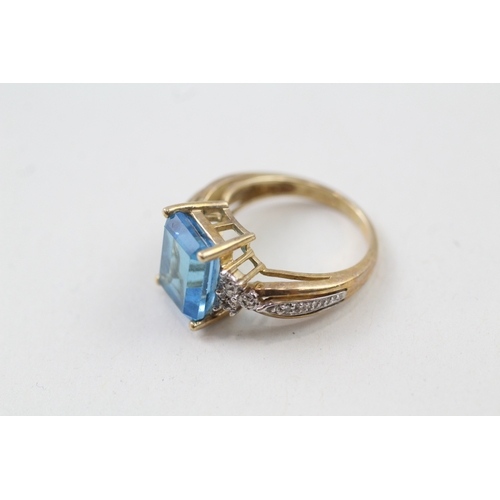 117 - 9ct gold blue topaz & diamond dress ring (3.5g) Size  J