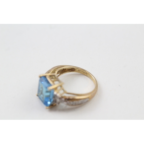 117 - 9ct gold blue topaz & diamond dress ring (3.5g) Size  J