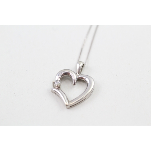 127 - 9ct white gold diamond set heart pendant with 9ct white gold chain (2.1g)