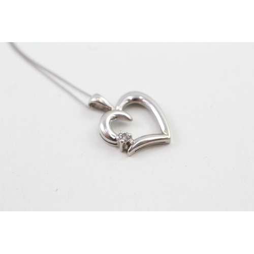 127 - 9ct white gold diamond set heart pendant with 9ct white gold chain (2.1g)