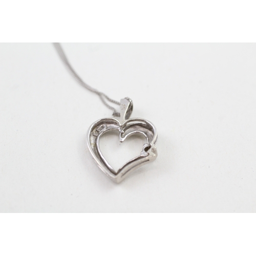 127 - 9ct white gold diamond set heart pendant with 9ct white gold chain (2.1g)