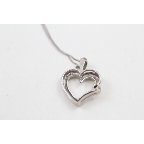 127 - 9ct white gold diamond set heart pendant with 9ct white gold chain (2.1g)