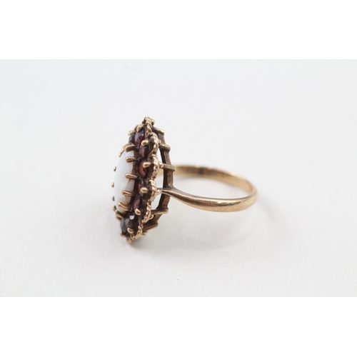 129 - 9ct gold vintage marquis opal and garnet halo cocktail ring (4.1g) Size  L