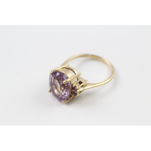 137 - 9ct gold amethyst solitaire cocktail ring with amethyst set shoulders (4.3g) Size  O