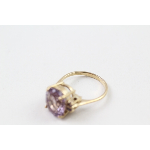 137 - 9ct gold amethyst solitaire cocktail ring with amethyst set shoulders (4.3g) Size  O