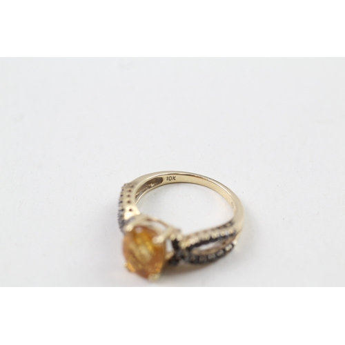 142 - 9ct gold citrine & blue gemstone ring (2.9g) Size  K 1/2