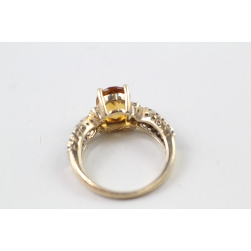 142 - 9ct gold citrine & blue gemstone ring (2.9g) Size  K 1/2