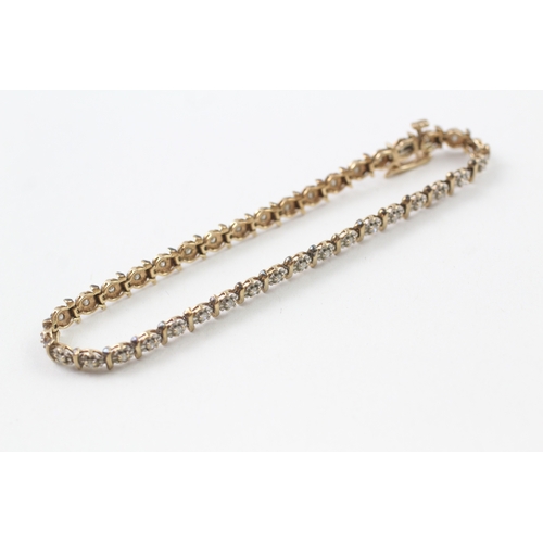 157 - 9ct gold diamond line bracelet (7g)