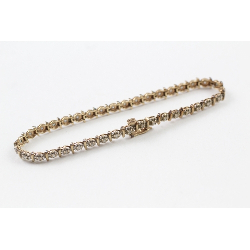 157 - 9ct gold diamond line bracelet (7g)