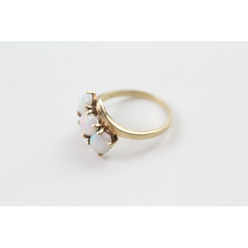 159 - 9ct gold opal trilogy cross over dress ring (2.3g) Size  M