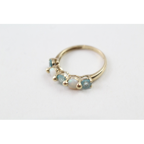 179 - 9ct gold opal & topaz five stone ring (1.6g) Size  L