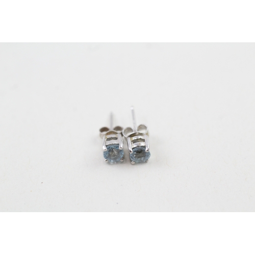 197 - 9ct white gold round cut aquamarine stud earrings (0.9g)