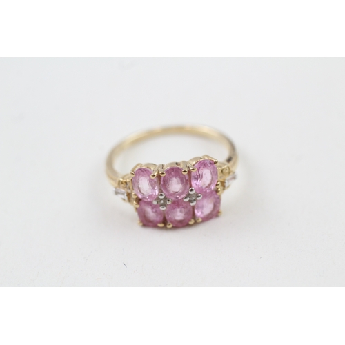 210 - 9ct gold pink sapphire & white gemstone dress ring (2.4g) Size  O