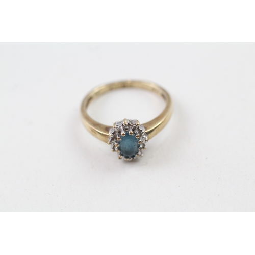 46 - 9ct gold blue topaz and diamond halo dress ring (2.6g) Size  M