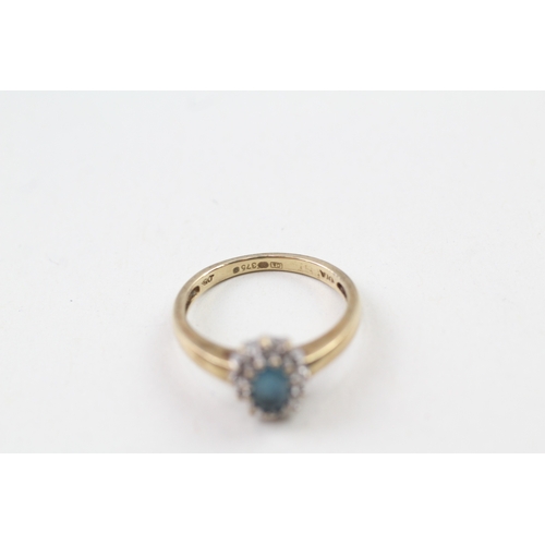 46 - 9ct gold blue topaz and diamond halo dress ring (2.6g) Size  M