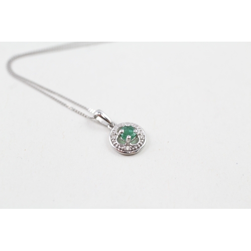 61 - 9ct white gold emerald and diamond halo pendant with 9ct white gold chain (1g)