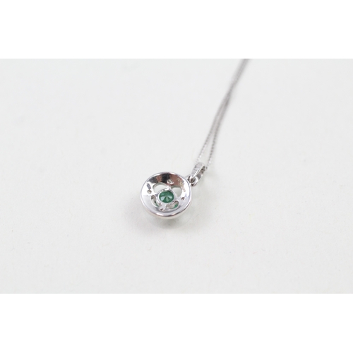 61 - 9ct white gold emerald and diamond halo pendant with 9ct white gold chain (1g)