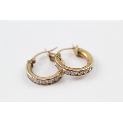 80 - 9ct gold cubic zirconia channel set hoop earrings with hinged posts (2.6g)