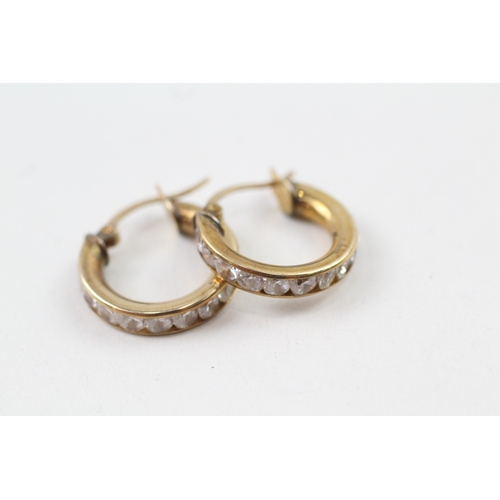 80 - 9ct gold cubic zirconia channel set hoop earrings with hinged posts (2.6g)