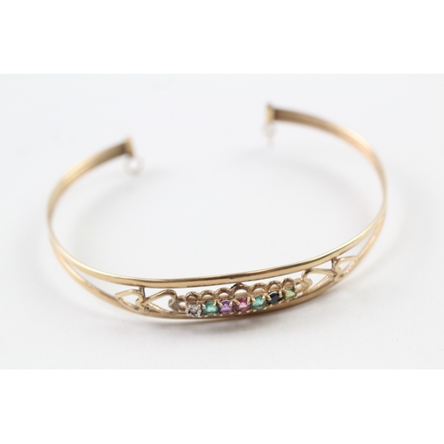 94 - 9ct gold 'DEAREST' gemstone bangle inc. diamond, emerald, amethyst, ruby, sapphire & tourmaline (5.3... 