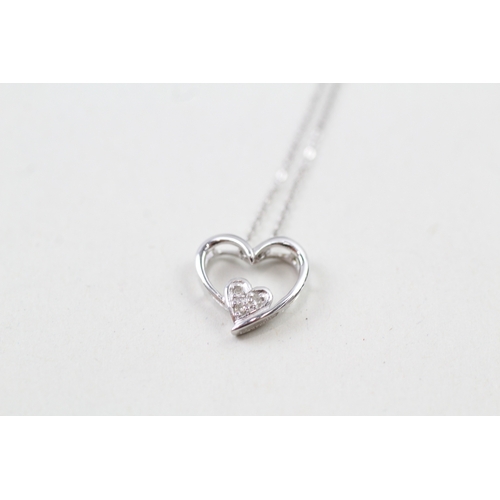 97 - 9ct white gold diamond set heart pendant with 9ct white gold chain (1.1g)