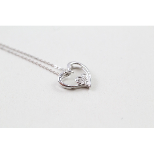 97 - 9ct white gold diamond set heart pendant with 9ct white gold chain (1.1g)