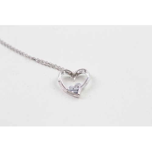 97 - 9ct white gold diamond set heart pendant with 9ct white gold chain (1.1g)