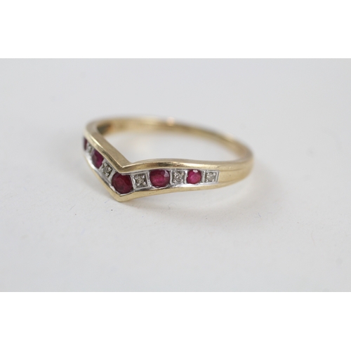 102 - 9ct gold ruby and diamond wishbone dress ring (2.4g) Size  V