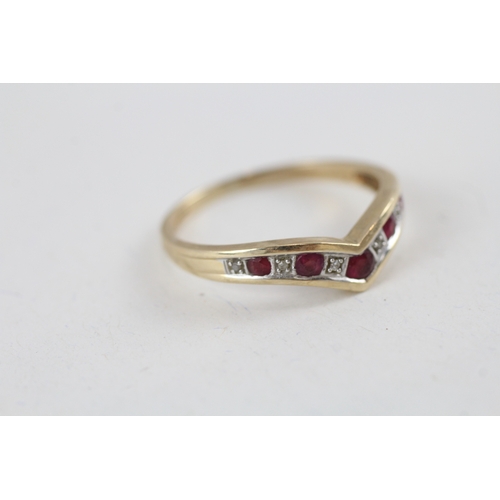 102 - 9ct gold ruby and diamond wishbone dress ring (2.4g) Size  V