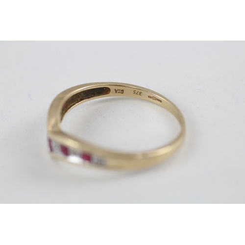 102 - 9ct gold ruby and diamond wishbone dress ring (2.4g) Size  V