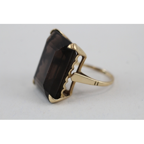 112 - 9ct gold smokey quartz cocktail ring (6.4g) Size  I