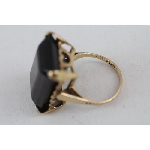 112 - 9ct gold smokey quartz cocktail ring (6.4g) Size  I