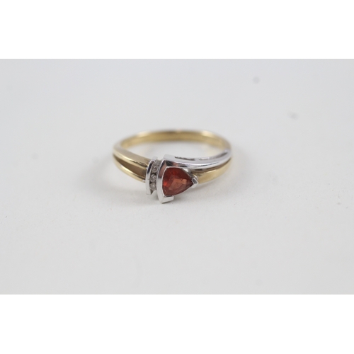 114 - 9ct gold diamond and red gemstone dress ring (3g) Size  O