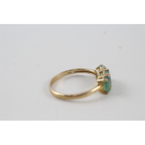 116 - 10ct gold emerald trilogy dress ring (2g) Size  N 1/2