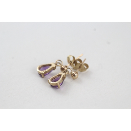 66 - 9ct gold pear cut amethyst drop earrings with posts (1.2g)