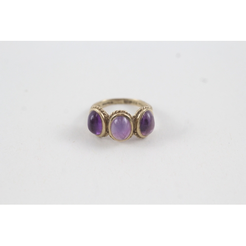 69 - 9ct gold vintage amethyst cabochon cut trilogy dress ring (2.8g) Size  K 1/2