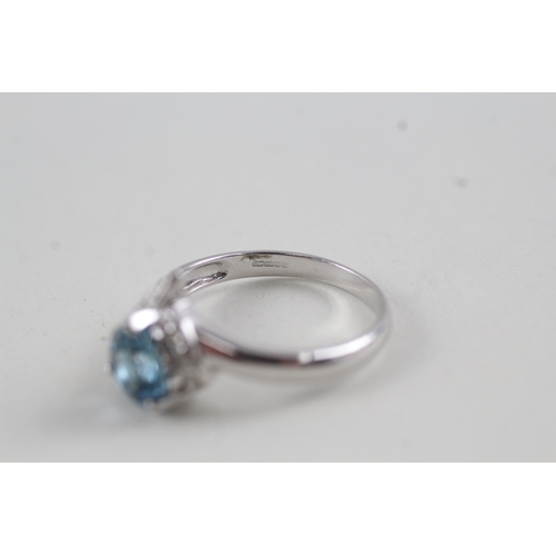 78 - 9ct white gold heart cut blue topaz and diamond dress ring (2.4g) Size  N