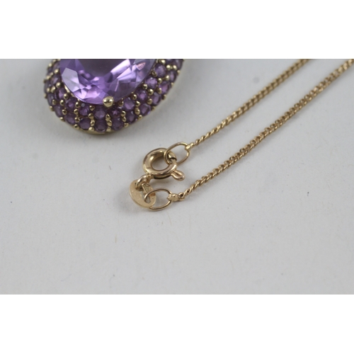 91 - 9ct gold amethyst halo cluster pendant with 9ct gold chain (5g)