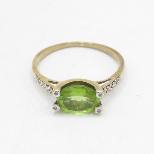 49 - 9ct gold oval cut peridot & diamond dress ring (1.5g) Size  K 1/2