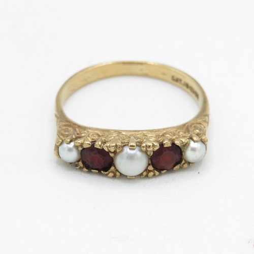 106 - 9ct gold vintage garnet and seed pearl five stone dress ring with patterned gallery (2.7g) Size  O