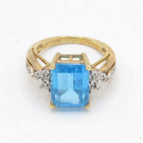 117 - 9ct gold blue topaz & diamond dress ring (3.5g) Size  J